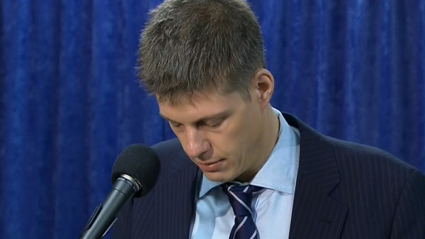 TTC chairman Adam Giambrone becomes emotional as he reads his statement during a press conference in Toronto, Wednesday, Feb. 10, 2010.