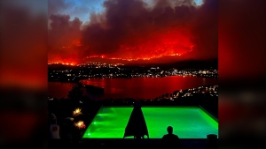 An evacuation order for more than 700 properties was issued for the Town of Osoyoos after an out-of-control wildfire crossed into British Columbia from Washington. The Eagle Bluff wildfire is seen burning from Anarchist Mountain, outside of Osoyoos, B.C., in a Saturday, July 29, 2023, handout photo. (THE CANADIAN PRESS/HO-Melissa Genberg)
