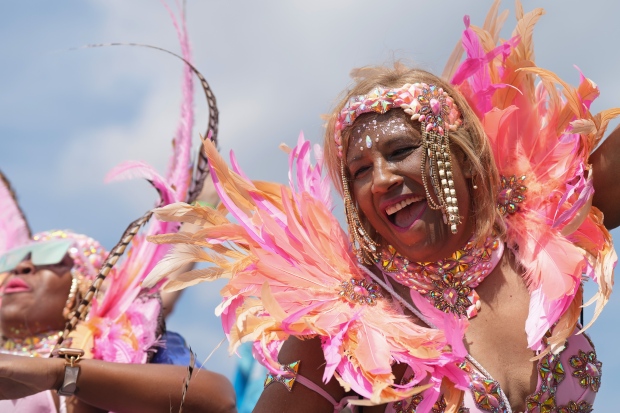A reveller takes part in the Toronto Caribbean Carnival, on Saturday, August 5, 2023. THE CANADIAN PRESS/Chris Young