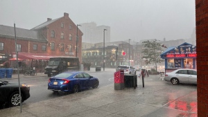Heavy rain falls in Ottawa's ByWard Market. (Josh Pringle/CTV News Ottawa)