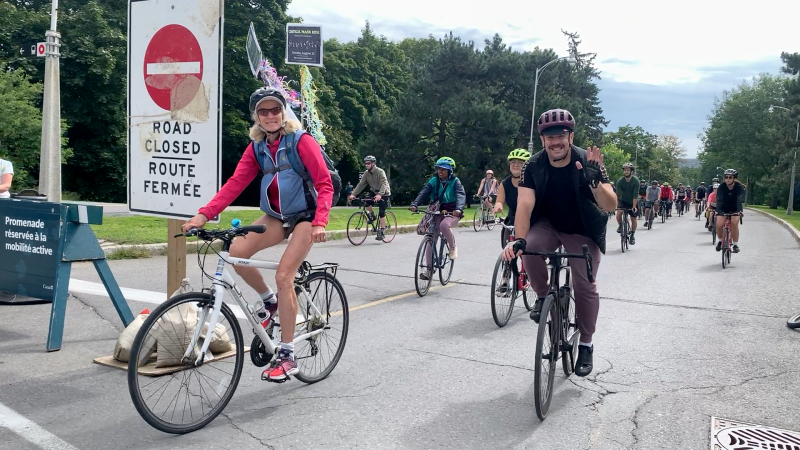 The 'Critical Mass Ride' travels down Queen Elizabeth Driveway on Saturday, calling for safe active transportation routes in Ottawa. (Jackie Perez/CTV News Ottawa)