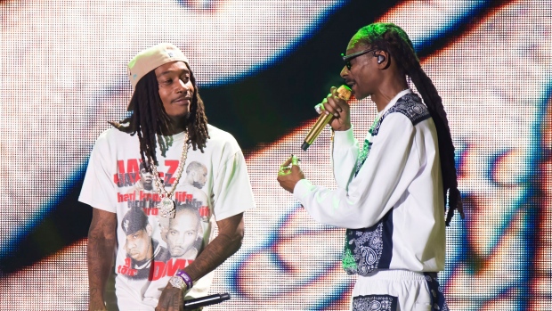 Rappers Wiz Khalifa, left, and Snoop Dogg perform at Hip-Hop 50 Live, celebrating 50 years of hip-hop on Friday, Aug. 11, 2023, at Yankee Stadium in the Bronx borough of New York. (Photo by Scott Roth/Invision/AP)