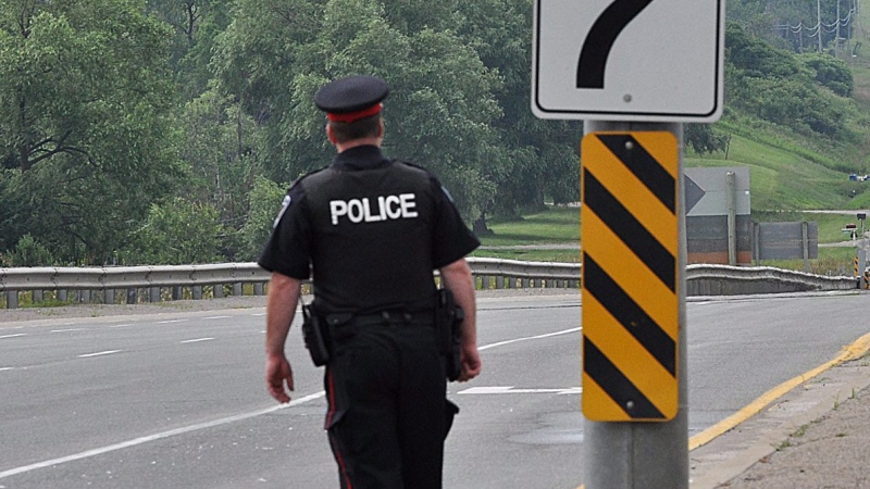 A York Regional Police officer can be seen in Newmarket, Ontario on Tuesday, June 28, 2011. THE CANADIAN PRESS/Aaron Vincent Elkaim