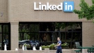  In this May 8, 2014, file photo, a man walks past the LinkedIn headquarters in Mountain View, Calif.  (AP Photo/Marcio Jose Sanchez, File)