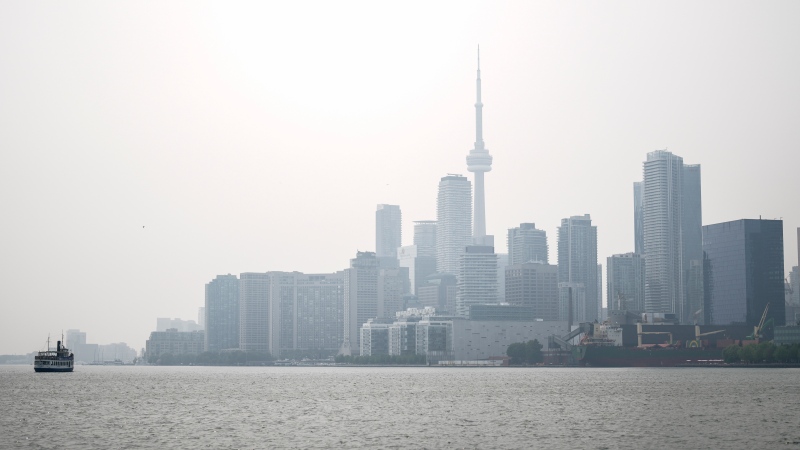 The Toronto skyline is pictured from Polson St. as wildfire smoke rolls into Toronto, on Wednesday, June 28, 2023. THE CANADIAN PRESS/Andrew Lahodynskyj