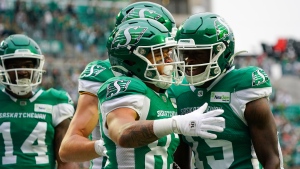 Saskatchewan Roughriders receiver Jerreth Sterns (83) celebrates with teammates after scoring a touchdown during the first half of CFL football action in Regina, on Sunday, August 20, 2023. THE CANADIAN PRESS/Heywood Yu