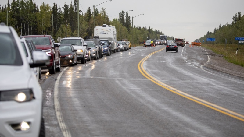 Evacuees from Yellowknife queue up to get gas at Big River Service in Fort Providence, N.W.T., Thursday, Aug. 17, 2023. THE CANADIAN PRESS/Bill Braden
