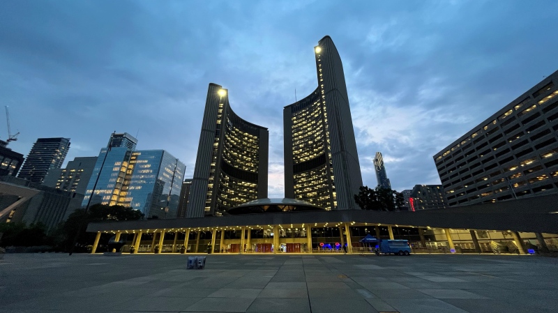 Toronto City Hall is pictured in the evening just beyond Nathan Phillips Square in downtown Toronto. (Joshua Freeman /CP24)