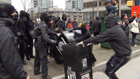 Anti-Olympic protesters rampage through downtown Vancouver, damaging businesses and vehicles on Saturday, Feb. 13, 2010 (CTV)