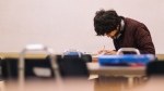 FILE: A student takes an exam (Jeswin Thomas, Pexels)