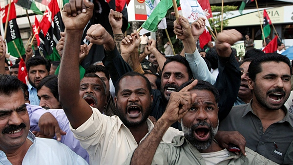 Supporters of Pakistan Peoples Party chant slogans during a rally to show their support for President Asif Ali Zardari, Sunday, Feb. 14, 2010. (AP / Fareed Khan)