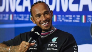 Mercedes driver Lewis Hamilton of Britain smiles during a news conference at the Monza racetrack, in Monza, Italy , Thursday, Aug. 31, 2023. (AP Photo/Luca Bruno)
