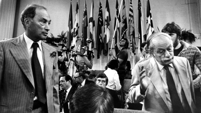 September 9, Ottawa--Quebec Premier Rene Levesque (R) shrugs his shoulders and walks away from Prime Minister Pierre Trudeau (L) after a chat prior to the beginning of the second day of the Constitution Conference Sept 9, 1980. (CP PHOTO) 1998 (stf- Drew Gragg)