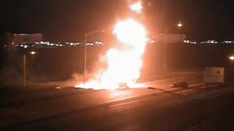 Flames erupt after tanker rollover on U.S. highway