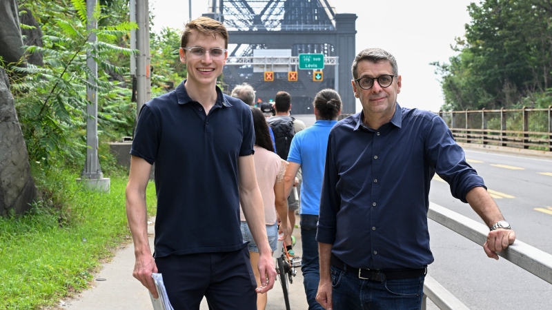 Quebec Conservative Leader Eric Duhaime, right, and Jean-Talon byelection candidate Jesse Robitaille stand by the Quebec Bridge as they walk with supporters to show damages on the structure, Monday, September 4, 2023 in Quebec City. Robitaille was launching his campaign.THE CANADIAN PRESS/Jacques Boissinot