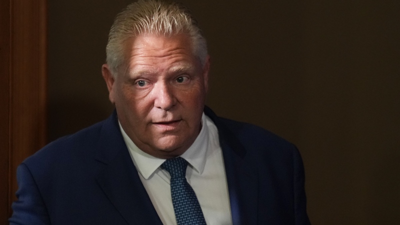 Ontario Premier Doug Ford enters a room to speak to journalists at the Queens Park Legislature in Toronto on Tuesday, September 5, 2023.  THE CANADIAN PRESS/Chris Young 