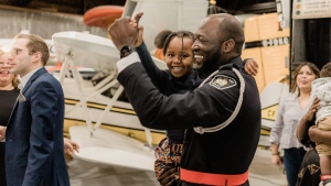 Const. Orrette Robinson dancing with a child at the Black History Month Gala hosted by ACCANO. 2023 (Sault Ste. Marie Police Service)