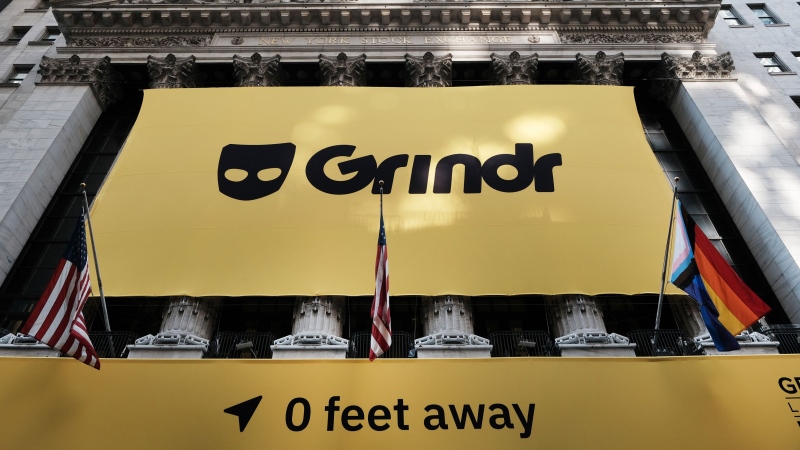 The LGBTQ2S+ social networking platform Grindr displays its banner outside of the New York Stock Exchange (NYSE), on November 18, 2022 in New York City. (Spencer Platt/Getty Images)