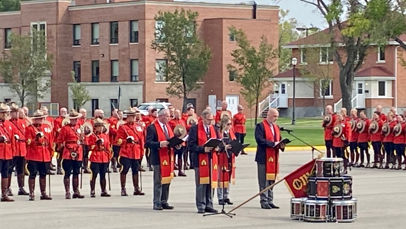 The new RCMP Guidon is draped over drums and blessed during a ceremony at the RCMP Training Academy on Friday afternoon. (Gareth Dillistone / CTV News) 