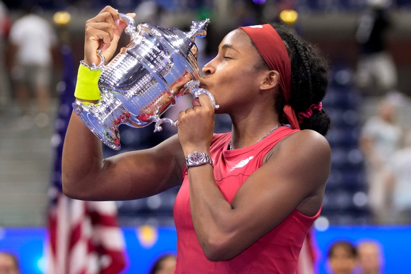 Coco Gauff, of the United States, kisses the championship trophy after defeating Aryna Sabalenka, of Belarus, in the women's singles final of the U.S. Open tennis championships, Saturday, Sept. 9, 2023, in New York. (AP Photo/Frank Franklin II)