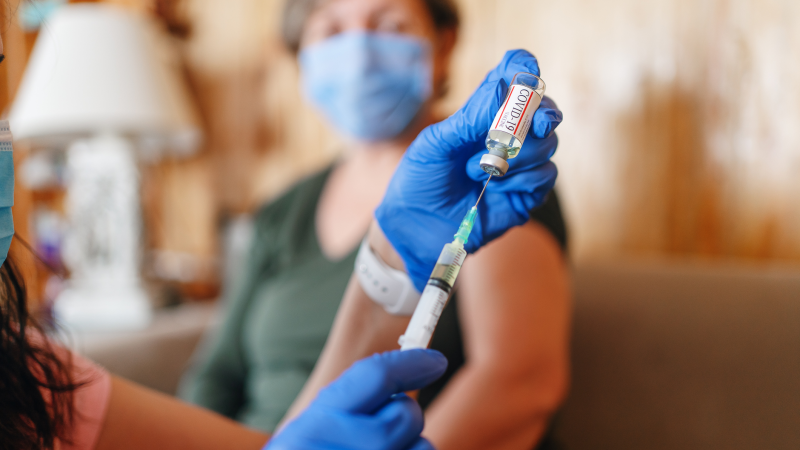 A nurse prepares a Covid-19 vaccination. (Getty Images)