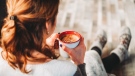 A woman sits with a cup of coffee in hand. Researchers have found that the number of coffee cups an individual consumes reveals their risk of developing depression and anxiety, according to a recent study. (Chait Goli / Pexels)