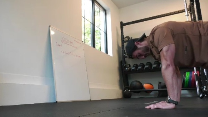 Sam Finn hopes to break the world record for the number of burpees in under an hour, with the goal of raising $80,000 for a cancer foundation in honour of his late brother. (CTV News/Matt Gilmour) 