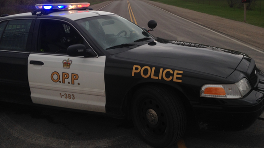 An Ontario Provincial Police cruiser blocks a road in this file image. 