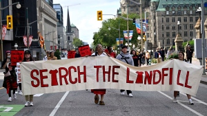 People march towards Parliament Hill on an International Day of Action to Search the Landfills, in Ottawa, on Monday, Sept. 18, 2023. The remains of Morgan Harris, Marcedes Myran and another woman named as Mashkode Bizhiki’ikwe, or Buffalo Woman, killed by an alleged serial killer, are believed to be in a landfill north of Winnipeg. (Justin Tang/THE CANADIAN PRESS) 