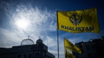 Khalistan flags are seen outside the Guru Nanak Sikh Gurdwara Sahib in Surrey, B.C., on Monday, Sept. 18, 2023, where temple president Hardeep Singh Nijjar was gunned down in his vehicle while leaving the parking lot in June. THE CANADIAN PRESS/Darryl Dyck