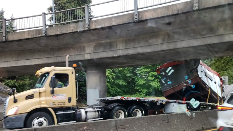 This photo, posted to Twitter by Miller Capilano Highway Services shows a truck that crashed into an overpass on Tuesday, Sept. 19, 2023. (Image credit: Twitter/MillerCapilano4)
