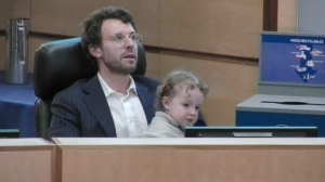 Councillor Dan LeBlanc can be seen here with his young daughter at a Regina City Council meeting on Sept. 13, 2023. (Courtesy: Access.ca)