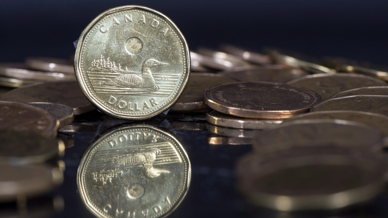 Canadian dollar coins are displayed in Montreal, Friday, January 30, 2015. (THE CANADIAN PRESS/Paul Chiasson)