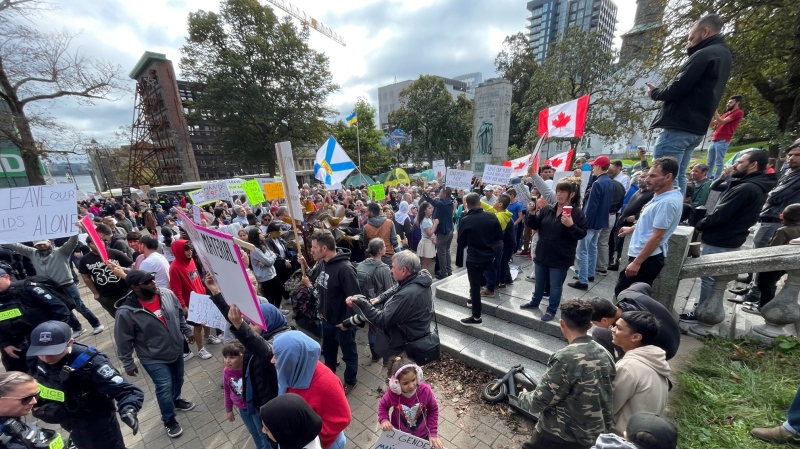 Many people gathered in Grand Parade in Halifax to voice their opinions on gender ideology and policy in schools. (CTV/Carl Pomeroy)