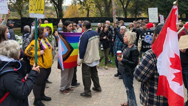 Hundreds of protesters rallied both in support and against a recently introduced policy regarding gender pronouns in schools. (Josh Lynn/CTV News)