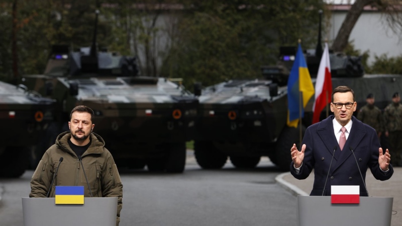 Poland's Prime Minister Mateusz Morawiecki, right, and Ukrainian President Volodymyr Zelenskyy attend a press conference in Warsaw, Poland, Wednesday, April 5, 2023. (AP Photo/Michal Dyjuk, File)