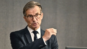 Governor of the Riksbank Erik Thedeen gestures during a press conference, in Stockholm, Thursday, Sept. 21, 2023. (Jonas Ekstromer/TT News Agency via AP)
