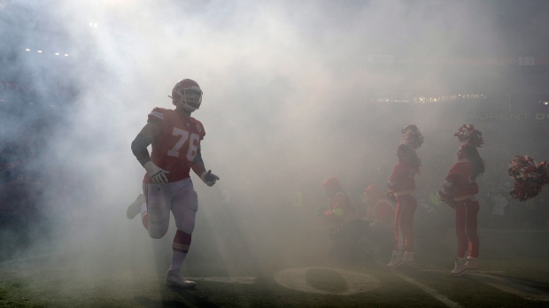 Kansas City Chiefs' Laurent Duvernay-Tardif (76) is introduced before the NFL AFC Championship football game against the Tennessee Titans on Sunday, Jan. 19, 2020, in Kansas City, MO. (AP Photo/Jeff Roberson)
