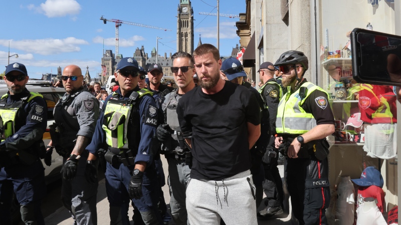 A protestor is arrested at a demonstration against sexual orientation and gender identity programs in schools, in front of Parliament Hill in Ottawa on Wednesday, Sept. 20, 2023. The protest was one of many across Canada, organized by "1MillionMarch4Children," as they protest against so-called "gender ideology" being taught in schools. (Patrick Doyle/THE CANADIAN PRESS)