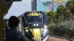 A Brightline train approaches the Fort Lauderdale station on Friday, Sept. 8, 2023, in Fort Lauderdale, Fla. (AP Photo/Marta Lavandier)