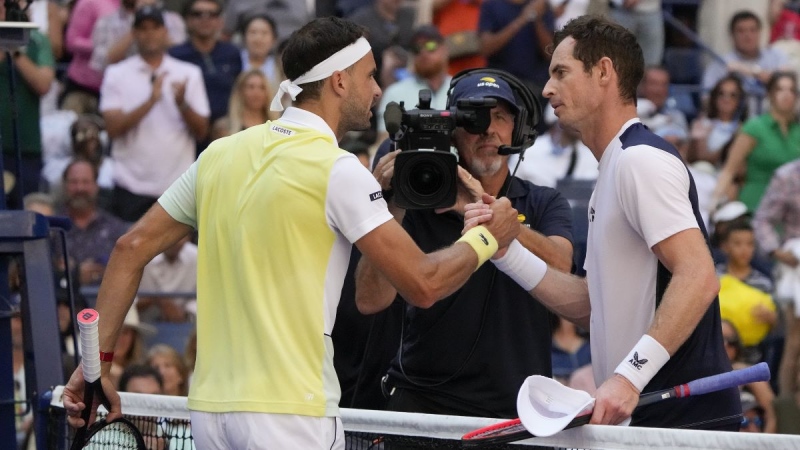 Andy Murray, of Great Britain, right, shakes hands with Grigor Dimitrov, of Bulgaria, after losing to Dimitrov during the second round of the U.S. Open tennis championships, Thursday, Aug. 31, 2023, in New York. (Mary Altaffer/AP Photo)