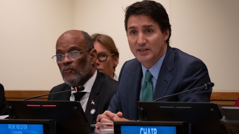 Haitian Prime Minister Ariel Henry looks on as Prime Minister Justin Trudeau delivers opening remarks at an event focusing on Haiti at the United Nations, Thursday, Sept. 21, 2023 in New York. THE CANADIAN PRESS/Adrian Wyld