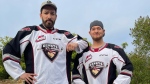 This photo provided by the Vancouver Giants shows HGTV's Drew Scott and singer Michael Buble, who are both part of the team's ownership group. 