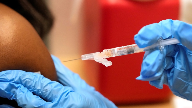 Pharmacist Kim Nguyen administers a Moderna Spikevax COVID-19 vaccine at a CVS, Wednesday, Sept. 20, 2023, in Cypress, Texas. (Melissa Phillip/Houston Chronicle via AP)