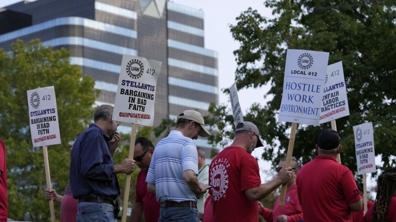 United Auto Workers march outside the Stellantis North American Headquarters, Wednesday, Sept. 20, 2023, in Auburn Hills, Mich. (AP Photo/Carlos Osorio)