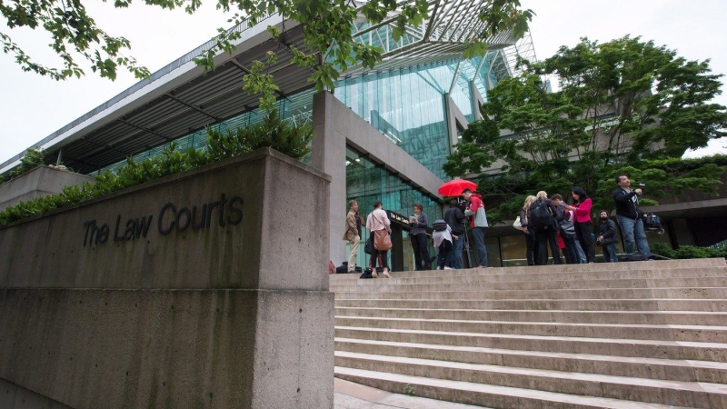 A sexual assault expert testifies under cross-examination at the trial of a man accused of killing a 13-year-old girl in a B.C. park. Media wait outside B.C. Supreme Court, in Vancouver, B.C., on Tuesday, June 2, 2015. THE CANADIAN PRESS/Darryl Dyck