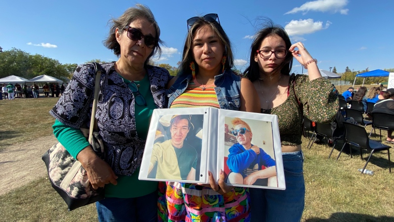 Mother, Debbie Francis and sisters Holly & Harmony Martin hold photos of their brother Nehemiah who died of an overdose on Sept. 9.