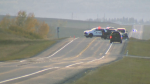 RCMP members at the scene of a fatal three-vehicle collision west of Okotoks, Alta., on Sept. 22, 2023.