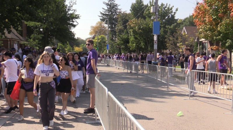 Emergency teams installed barricades in the middle of Broughdale Avenue in London, Ont. to help keep the students from the middle of the road, ensuring first responders could get down the road on Sept. 23, 2023. (Brent Lale/CTV News London)