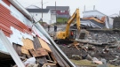 Severe weather caused more than three billion dollars' worth of insured damage in Canada in 2022, from flooding to storms to Hurricane Fiona. A heavy machinery operator continues the cleanup from the post-tropical storm Fiona in Port aux Basques, N.L. on Thursday, Sept.29, 2022. (THE CANADIAN PRESS/Frank Gunn)